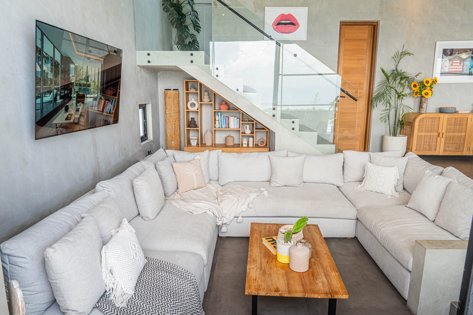 Living room with staircase and bookshelves